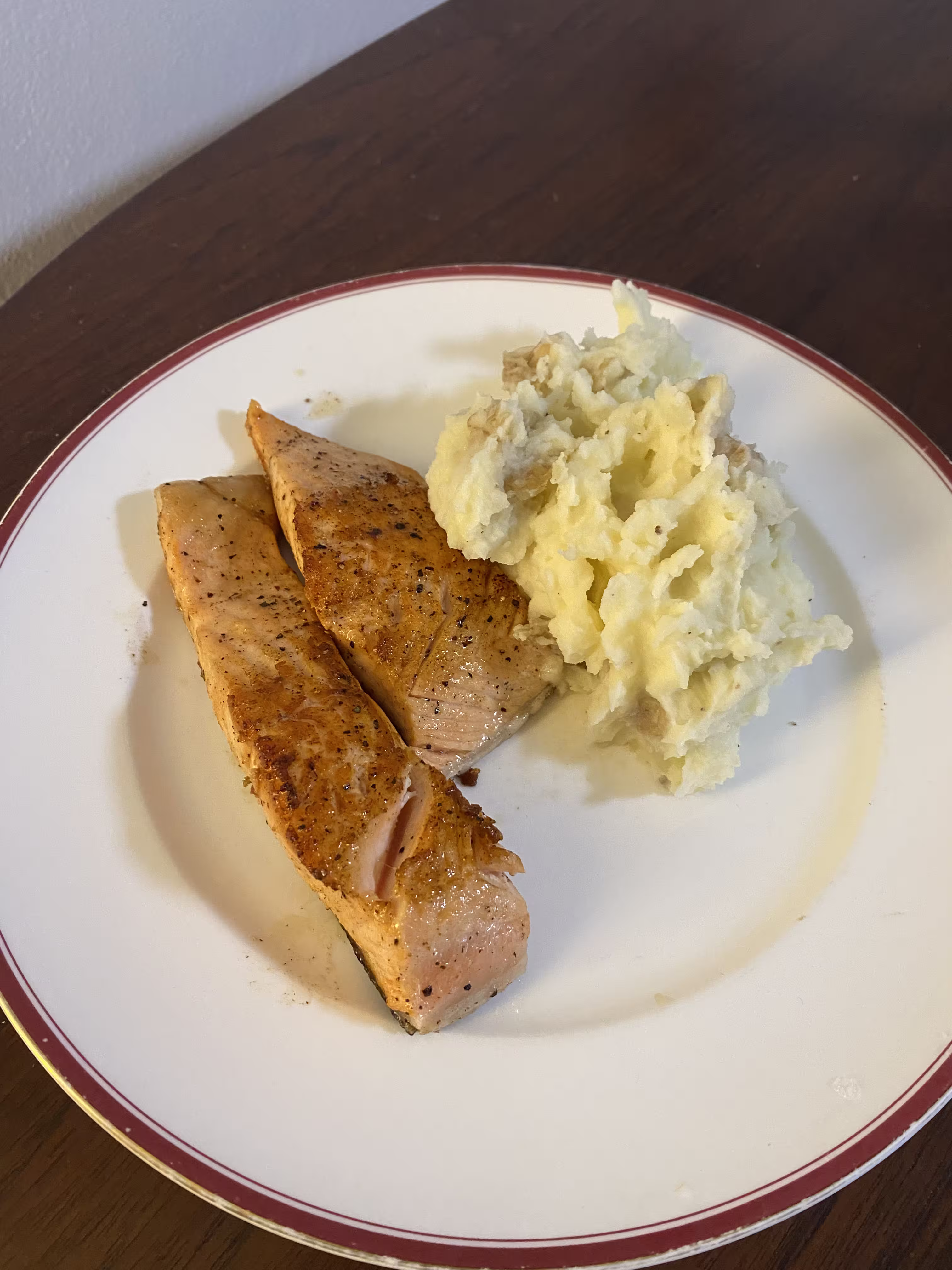 Salmon and mashed potato on plate